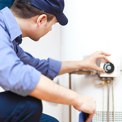 Man working on a water heater